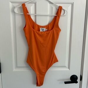 PRINCESS POLLY: orange bodysuit
